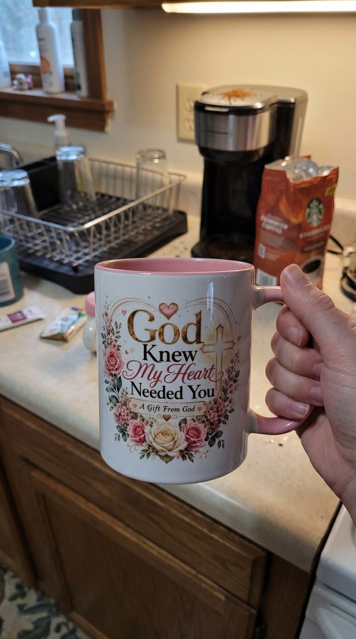 Customer holding the pink God Knew My Heart Needed You mug